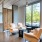 The resident lounge at our apartments for rent in Fairfax, VA, featuring cushioned chairs with tables.