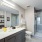 Model bathroom at our apartments for rent in Fairfax, featuring white countertops and a shower / bath combo.