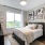 Large bedroom with bed and big windows