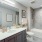 Model bathroom at our apartments for rent in Fairfax, featuring white countertops and a shower / bath combo.